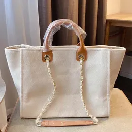 Nowa torba designerska klasyczna torba na tote duża pojemność ręczna torba luksusowa wysokiej jakości dzianinowa moda wszechstronna kwadratowa perła inkrustowana luksusowa torba 2024 04