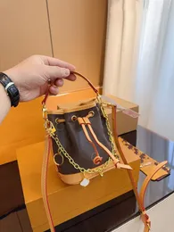 24SS Women's Luxury Designer New Drawstring Small Bucket Bag Women's Handbag Crossbody Purse Delicate Chain Decoration 16CM
