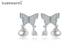 Luoteemi yeni yüksek kaliteli kadınlar güzel bayanlar imitasyon inci kelebek tasarımı gümüş pim kulak saplamaları küpeler parti mücevherleri9626357