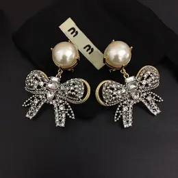 Mu marca de luxo bowknot designer brincos para mulheres brilhando cristal diamante nó doce flor CZ zircão brinco anéis de orelha brincos jóias