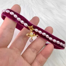 Desginer Viviane Weswoods Jewelry نسخة من الإمبراطورة الغربية Dowager Baroque Pearl Necklace Personalized Baroque Water Drop Ribbon Gold Purple Pearl