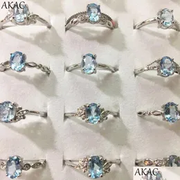 Solitaire Ring 5ings 10ings AKAC Natural Blue Topaz Ca57mm Stone Women Justerbar 231007 Drop Leverans smycken DHM7H