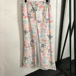 Calça de impressão de flores coloridas Botão de designer feminino calças de perna reta elegância sexy de cintura alta