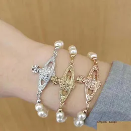 Bracciale rigido Vivian Bracciale Viviennewood Western Empress Dowager Classico diamante piatto Perla Oro rosa e argento Consegna a goccia Dhop9