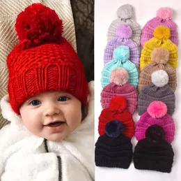 卸売りの子供ポンポンハットベイビーウィンターハットニットウールビーニーキャップ新生児温かいかぎ針編みの帽子