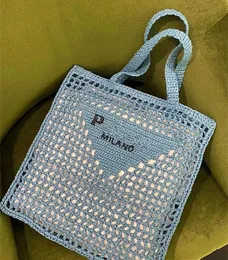 Borse da spiaggia di moda di design di lusso Borsa a tracolla da donna Borsa a secchiello di personalità Paglia di alta qualità Buona consistenza Atmosfera minimalista Borsa tessuta da donna B