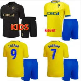 Cadiz Futbol Formaları Cadiz CF 2023 2024 Lozano Alex Bodiger Juan Cala Camiseta Ascenso A Liga Santander de Carnaval Kids Kit Home Away Away 3. Futbol Gömlekleri