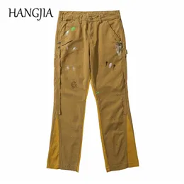 Pantalones de mezclilla acampanados pintados desgastados vintage Hombres Ropa de calle urbana Patchwork Jeans Hip Hop Splash Ink Graffiti Micro pantalones acampanados 2218h