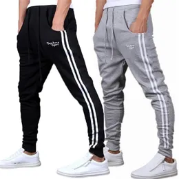 Primavera Verano Pantalones para hombre Moda Pantalones de chándal ajustados Joggers para hombre Pantalones ajustados a rayas Ropa de gimnasios Tallas grandes 3XL Pantalón harén C320b