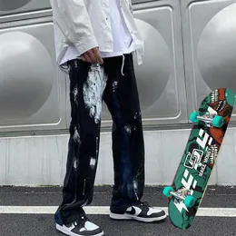 Mäns jeans och kvinnors lösa stänkbläck Y2K -byxor Skateboard Hip Hop Skating Wide Leg2343