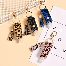 Travel Bottle Keychain Holder Leopard Print Hand Sanitizer Holder with Clear Refillable Bottles Plastic Bottles Containers Tassel Refillable Bottle Holder