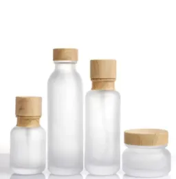 wholesale Wholesale Frosted Glass Jar Lotion Cream Bottles Round Cosmetic Jars Hand Face Lotion Pump Bottle with wood grain cap Bottles ZZ