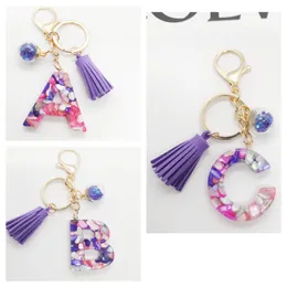 2023 new European and American fashion English letters resin colored stone keychain bag fringe accessories, suitable for girls and women