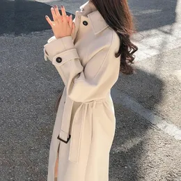 Kvinnors ullblandning elegant faux ullrockar vinter koreanska mode fast färg bälte tjockare långjacka kvinnlig löst alla matchblandningar utkläder 230922