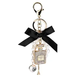 Creative Handmade Diy Diamond Perfume Bottle Accessories Alloy Bow Pearl Luxury Keychain Purses Charm Pendant YS0683660826
