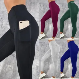 Kvinnors leggings fitness 2023 sport yoga löpande byxor sidtelefonfickor kvinnor kläder sexiga tjej kvinnor