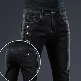 Trendy herenkleding Slanke zwarte jeans met knopen Effen kleur Stretch Skateboard Multi-knopen Jeugd Mannelijke skinny denimbroek