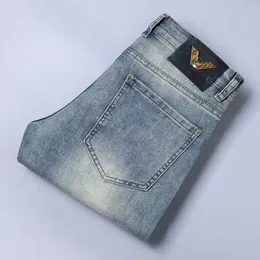 Jeans di lusso con lettere a colori misti di design Pantaloni da lavoro vintage da moto con toppa sottile in tessuto elasticizzato lavaggio dritto resistenti all'usura