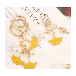 Keychains Lanyards Imitation Ginkgo Leaf Keyring For Women Pearl Pendant Key Chains Car Bag Charms Personliga kvinnliga smycken Gif Dhdee