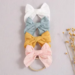 ヘアアクセサリー14pcs/lot fable baby bow headband bows生まれのシャワーギフト幼児アクセサリー