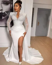 2023 Sexy Mermaid Wedding Dresses Gorgeous African High Neck Lace Appliques Pearls Beads Side Split Illusion Long Sleeves Vestidos De Novia Bridal Gowns Overskirts