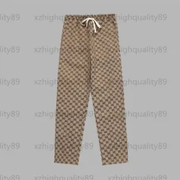 Damenhose, Jogginghose, Designer-Druckhose, volle Buchstaben, dunkle Drucke, Taschentiger, Stickerei, braun, weites Bein, modische, lässige Designer-Damenhose