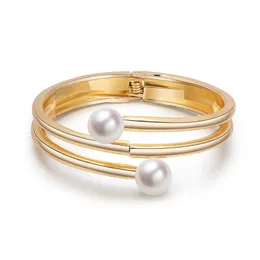 designer bracelet popular jewelry minimalist bracelet with multiple layers of lines wrapped around a double headed pearl bracelet with an open gold plated bracelet