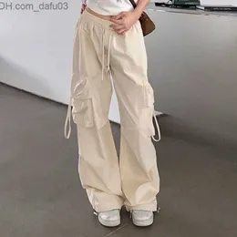 Pantaloni da donna Capris Zoki Hip Hop Y2K Pantaloni cargo Abbigliamento da strada da donna Harajuku Tasca grande Casual Pantaloni larghi da uomo a vita alta Design solido Z Z230809