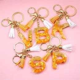 Chaços de chaveiros laranja a-z de letra inicial Keychain com dupla borla colorida recheio de pedra resina inglesa saco de cadeia de cadeia