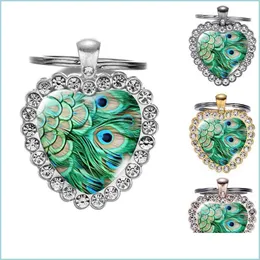 Tornari percorsi Green etnico Boho Peacock Feather Glass Art Heart HeartCey Fatto a mano Porta di tastiera metallica di grado superiore 4 Col dhl2e