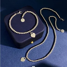 Новая спроектированная мода 925 Серебряное T-буквальное персиковое сердце Золотое колье из сети
