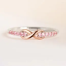 Eheringe Huitan Ewigkeit Infinity Form Frauen mit rosa Kubikzirkonia Romantic Vorschlag Engagement Geschenk