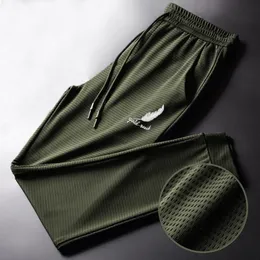 Calças masculinas Joggers Casual Rápula de seda de seda de gelo seco rápido ostenta pistas de moletom finas tornozelo de rua amarrada