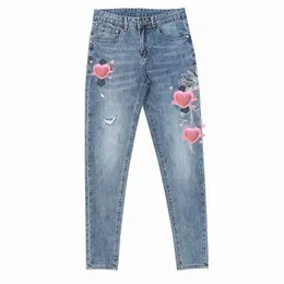 2023 designer maschi jeans high street viola per uomini pantaloni pantaloni donne oversize oversize patch buco denim snello sottile