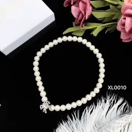 Toppdesigner Miumiu Fashion Pendant New Pearl Bow Super Immortal Cool Style Classic Simple Fashion Sweater Chain Halsband Alla hjärtans dag Presenttillbehör smycken