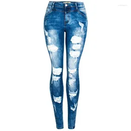 Женские джинсы растягивают худые эластичные рваные женщины разрушенные брюки с карандашными брюками.