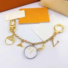 Ny stil topp qualtiy designer nyckelchain mode handväska hänge bil kedja läder nyckelring lyx charm unisex väska keyring prydnadsgåvor tillbehör tillbehör