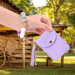 Keychains armbandsarmband Keychain med plånbok för kvinnor Silikonpärlade bilnyckelringar Tassel Elastic Bangle Card Holder