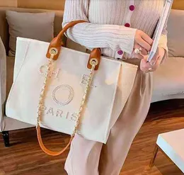 Luxury Women's Classic Ch Brand Canvas Handbag Fashion Pearl Beach Hand Bag designer Kvinnlig ryggsäck Små förpackningar Portabla shoppinghandväskor 0826