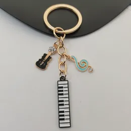 Nyckelringar lanyards söta emalj Musikinstrument Keychain Obs tangentbord gitarr nyckel ringmusik kedjor för konstnärsgåvor diy handgjorda smycken 230831