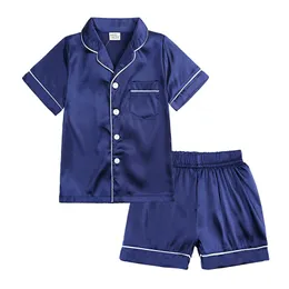 Niños Pajamas de verano Sets Silk Satin Homewear Biendos para niños Pajama Pajamas Cubra de manga corta Tops pantalones cortos de sueño205r