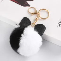 Anéis-chave exclusivos para imitação de dois tons transfronteiriço Rex Rabbit Fur Ball Keychain Diamond Bow para mulheres carros e bolsas Pingente de anel-chave R230301