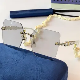 Neue Modedesignerin Frauen Sonnenbrille 0644 Quadratrahmenlos mit Kettenmetalltempelkristall kleiner Diamant UV400 Schutz 342g