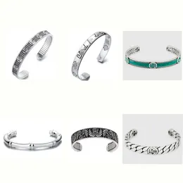 I migliori gioielli di design in argento sterling utilizzati da amanti maschi e femmine con testa di teschio e margherita che intagliano il braccialetto smaltato verde