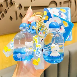 Keychains 액체 부동 곰 키 링 블루 병 아크릴 펜던트 커플 여자 친구 배낭 키 체인 선물