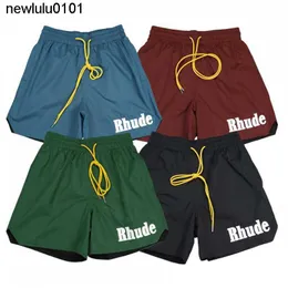 Rhude Men Designer New Fashion Summer Mens Shorts Spectpants Phoint Women مصمم سراويل قصيرة للجنسين رسائل مطبوعة Mens Beach Pant