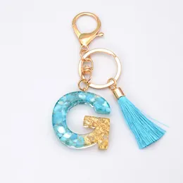 Keychains Fashion Tassel Blue Gold for Keys Kvinnliga smycken A-Z Letters Inledande harts Handväska Pendant Söt nyckelchain Tillbehör Keychains