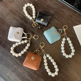 Favor de fiesta Venta directa de fábrica bolso de perlas bolso colgante llavero de coche hecho a mano mini bolso accesorios accesorios pu cuero d hebilla