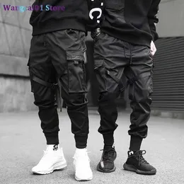 wangcai01 Pantaloni da Uomo Nastri Harem Joggers Pantaloni Cargo da Uomo Streetwear 2023 Hip Hop Tasche Casual Pantaloni da Pista Pantaloni da Uomo Harajuku Moda 0318H23