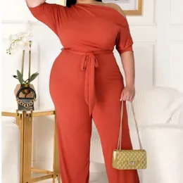 Kvinnors plus size byxor mode plus size kvinnors fasta färgbandage lutande axel blossad jumpsuit avslappnad lämplig för vänner fest set 230324